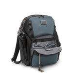 Blue and black TUMI backpack on a white background