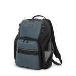 Blue and black TUMI backpack on a white background