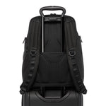 Black TUMI backpack with a handle and shoulder straps on a white background
