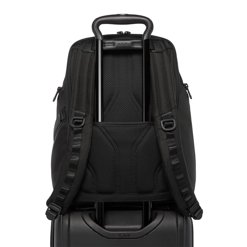 Black TUMI backpack with a handle and shoulder straps on a white background