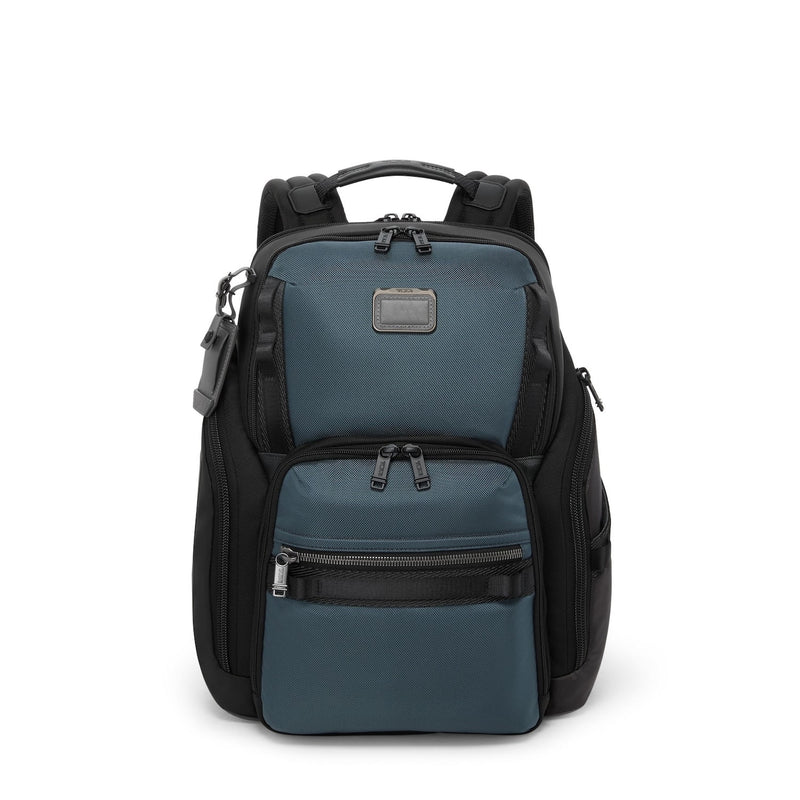 Blue TUMI backpack with black accents on a white background