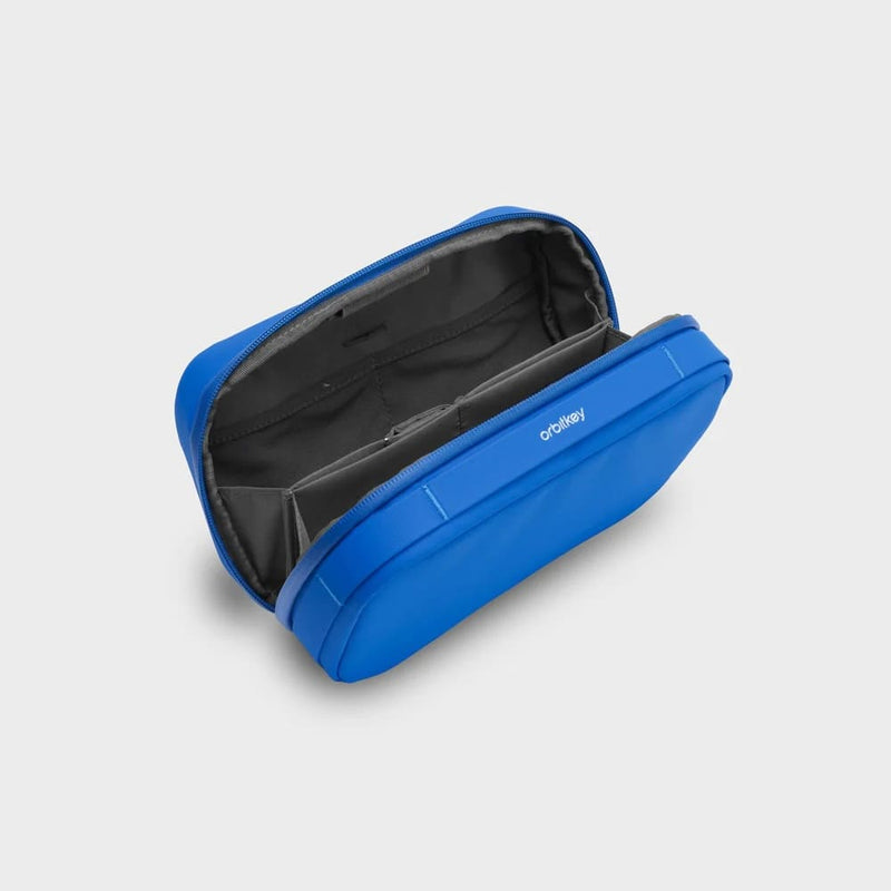 Blue orbitkey carrying case with open lid on a light gray background