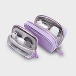 Purple orbitkey travel case with electronic accessories on a light gray background
