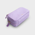 Purple orbitkey travel case with gold zipper on a light gray background