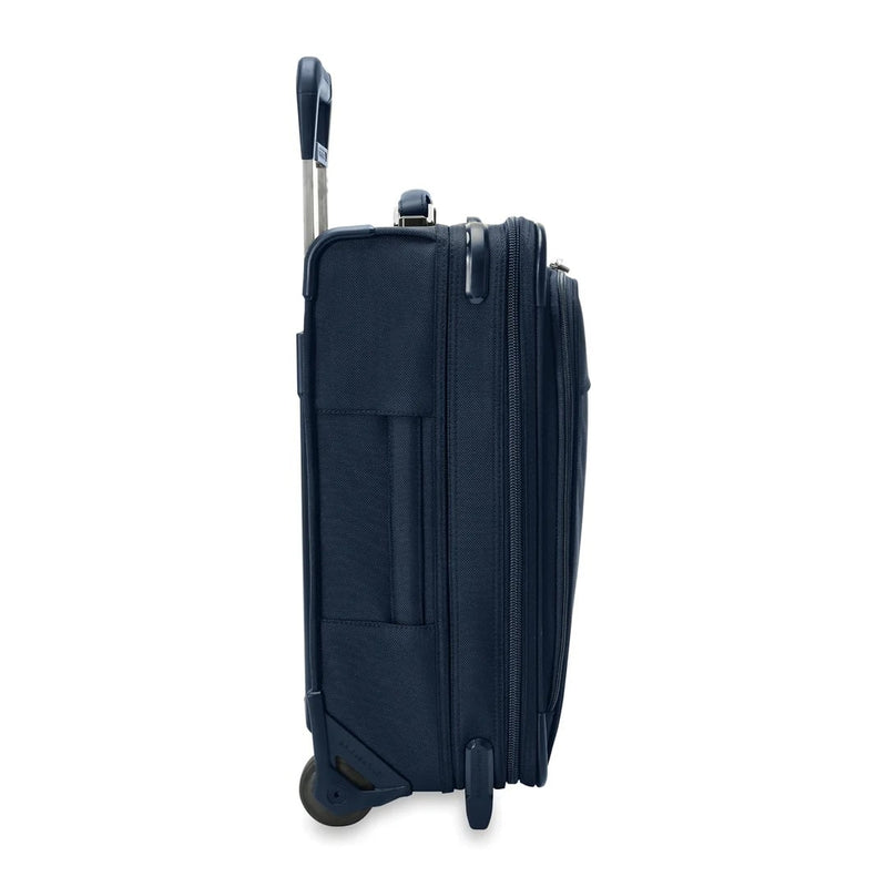 side of navy Briggs & Riley Baseline Global 2-Wheel Carry-On