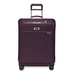 front of plum Briggs & Riley Baseline Medium Expandable Spinner