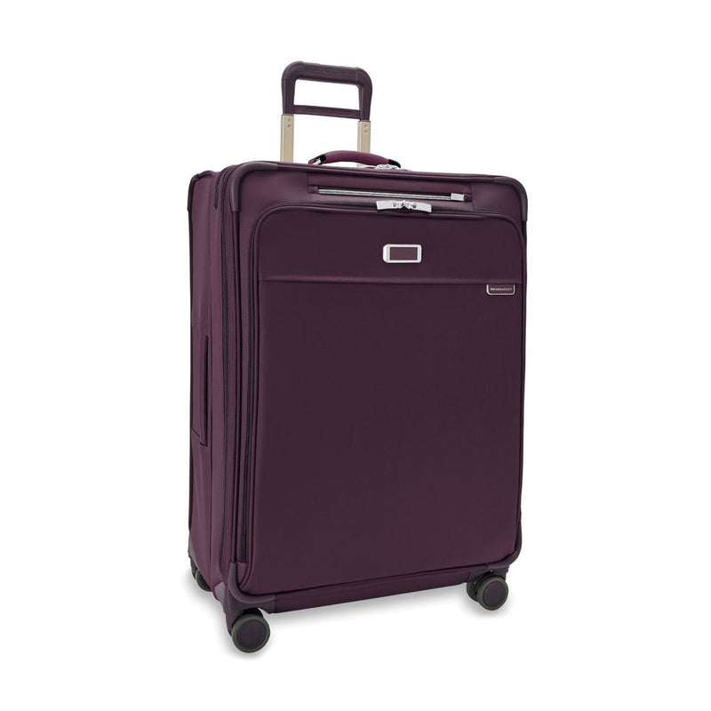front of plum Briggs & Riley Baseline Large Expandable Spinner