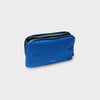 Blue orbitkey pouch with a zipper on a light gray background