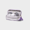 Purple and white orbitkey travel organizer with electronic devices on a light gray background