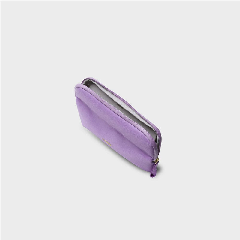 Purple orbitkey pouch with a zipper on a light gray background