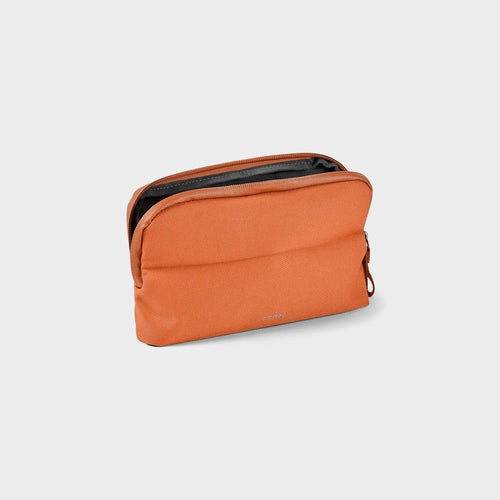 front of terracotta Orbitkey Desk Pouch