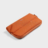 front of terracotta Orbitkey Desk Pouch