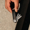 in hand black Orbitkey Hybrid Leather Key Organizer