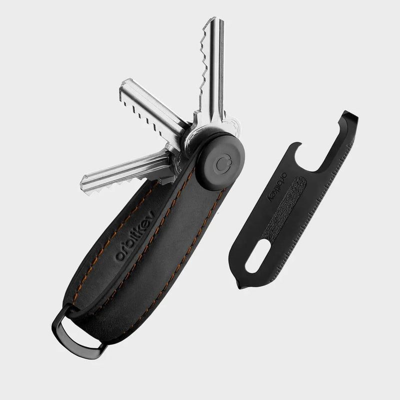 orbitkey multi-tool keychain with leather case and attached tool on a light gray background