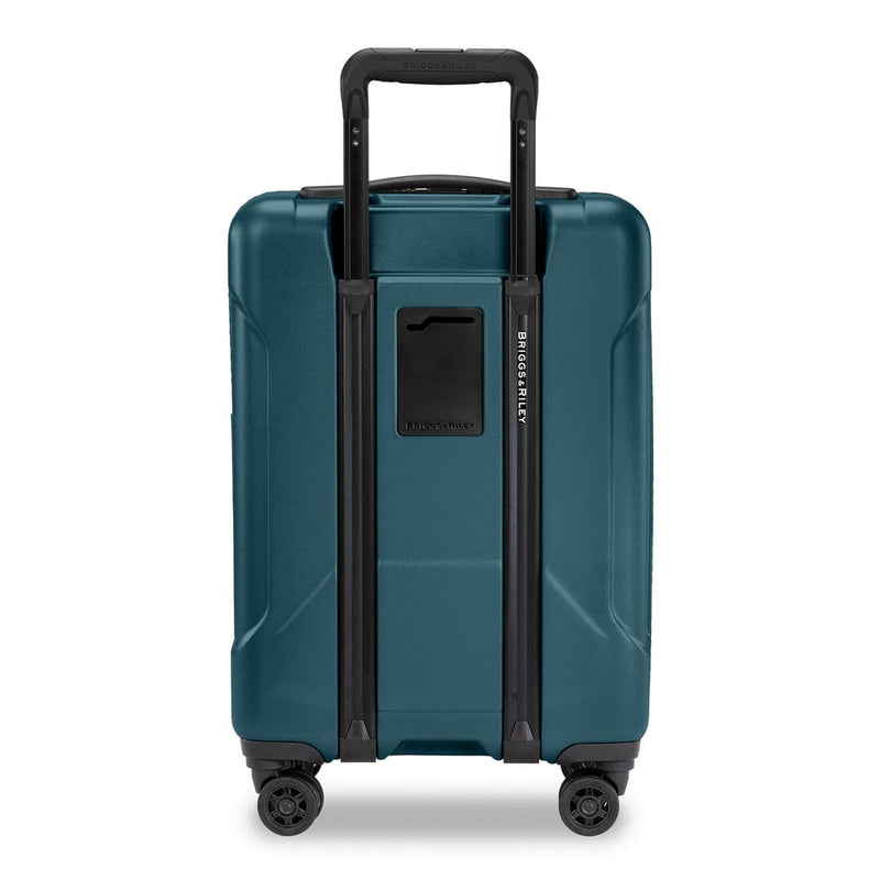 Ocean Briggs & Riley suitcase with black handle and wheels on a white background