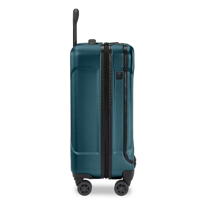 Ocean Briggs & Riley suitcase with black wheels and handle on a white background