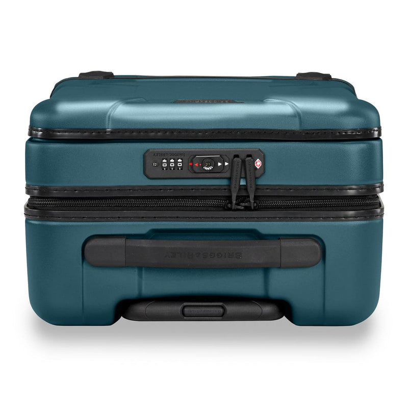 Ocean Briggs & Riley suitcase with black handle and zipper on a white background