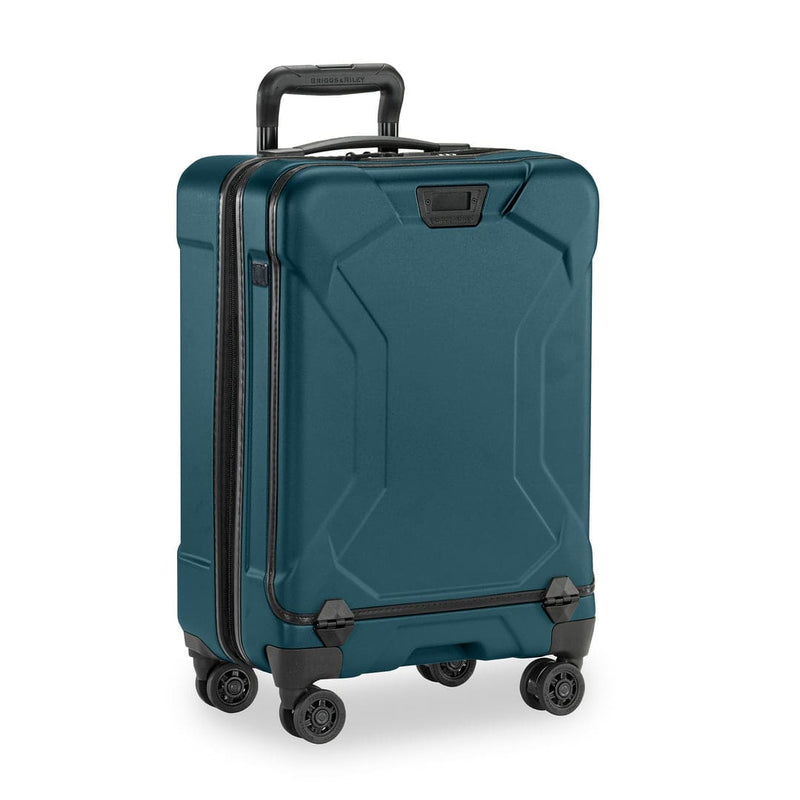 Ocean Briggs & Riley suitcase with black handle and wheels on a white background