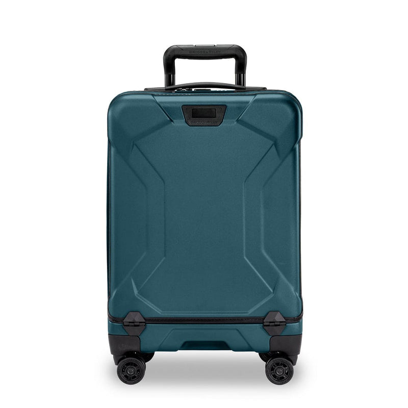 Ocean Briggs & Riley suitcase with black wheels and handle on a white background