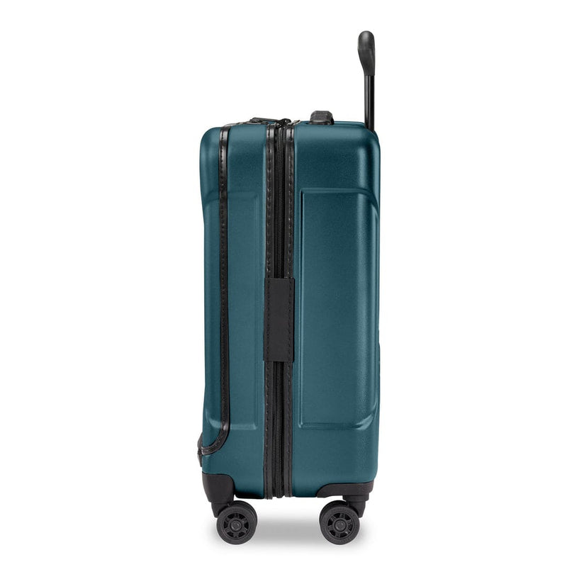 Ocean Briggs & Riley suitcase with a black handle and wheels on a white background