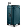 Ocean Briggs & Riley suitcase with black handles and wheels on a white background