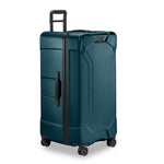 Ocean Briggs & Riley suitcase with black handles and wheels on a white background