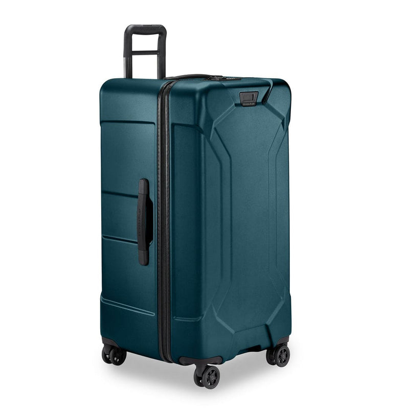 Ocean Briggs & Riley suitcase with black handles and wheels on a white background