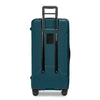 Ocean Briggs & Riley suitcase with black handle and wheels on a white background
