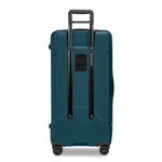 Ocean Briggs & Riley suitcase with black handle and wheels on a white background