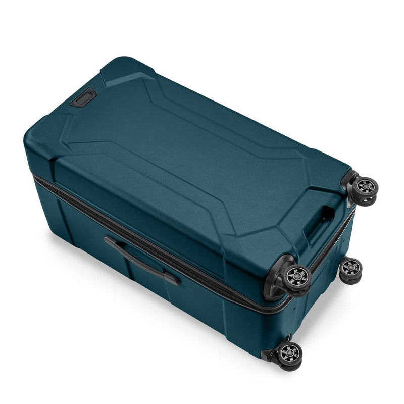 Ocean Briggs & Riley suitcase with wheels on a white background