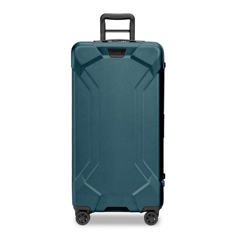 Ocean Briggs & Riley suitcase with geometric design on a white background