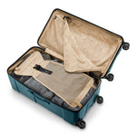 Open ocean Briggs & Riley suitcase with beige interior on a white background