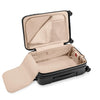 Open Briggs & Riley suitcase with beige interior on a white background
