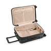 Black Briggs & Riley suitcase with open lid on a white background