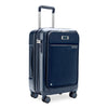 Navy blue Briggs & Riley suitcase with wheels and handle on a white background