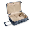 Open navy blue Briggs & Riley suitcase with beige interior on a white background