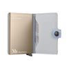 Gold and gray Secrid wallet with 'Mauritshuis' branding on a white background