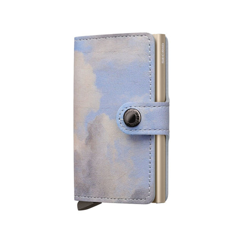 Cloud-patterned Secrid wallet with a metallic button on a white background