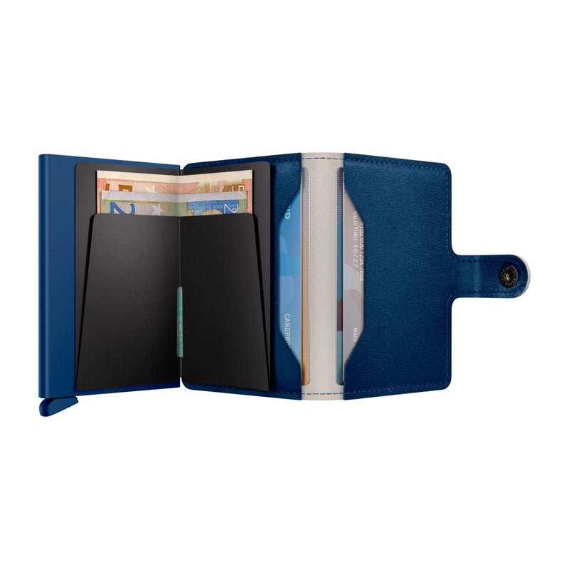Blue Secrid wallet with card slots and money clip on a white background