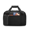 Black Briggs & Riley travel duffel bag with zippers open, showing a passport and wallet on a white background.
