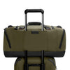 Two green Briggs & Riley bags with black handles and zippers on a white background
