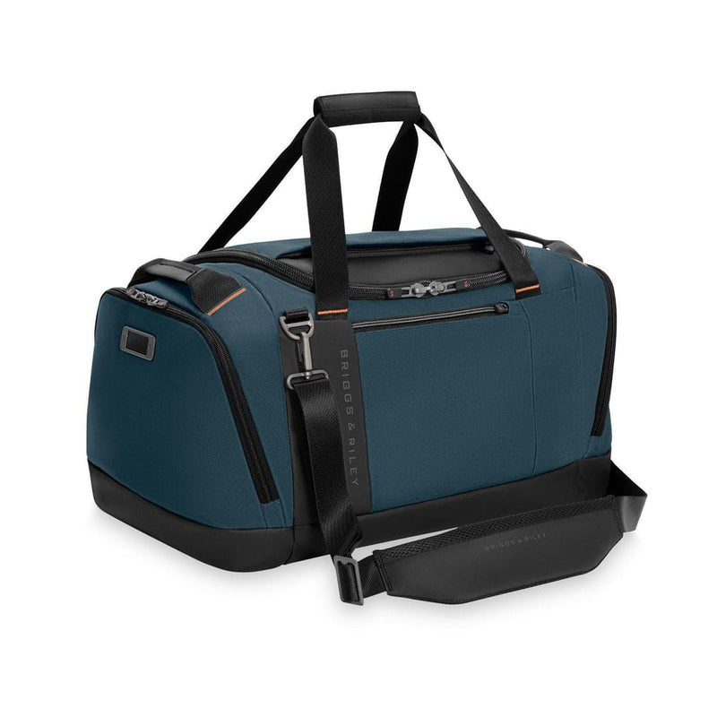 Blue Briggs & Riley duffel bag with black straps on a white background