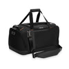 Black Briggs & Riley travel duffel bag with shoulder strap on a white background