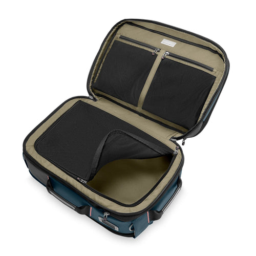 Open Briggs & Riley backpack with black interior on a white background