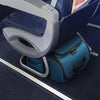 Blue Briggs & Riley suitcase under an airplane seat
