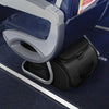 Black Briggs & Riley suitcase under an airplane seat