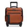 Orange Briggs & Riley suitcase with black accents on a white background