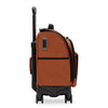Orange Briggs & Riley  suitcase with black wheels and handle on a white background