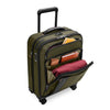 Green Briggs & Riley suitcase with open compartment showing packed items on a white background