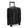 Black Briggs & Riley rolling suitcase with handle and wheels on a white background